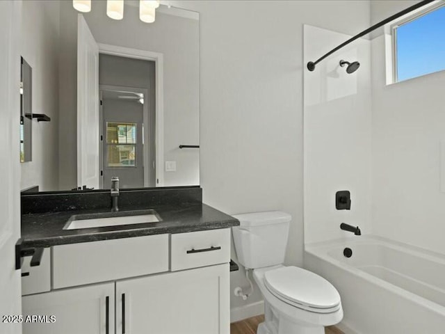 full bathroom with shower / washtub combination, plenty of natural light, vanity, and toilet