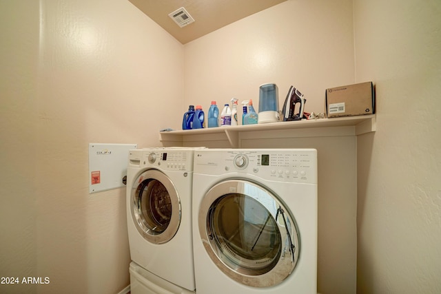 clothes washing area featuring independent washer and dryer