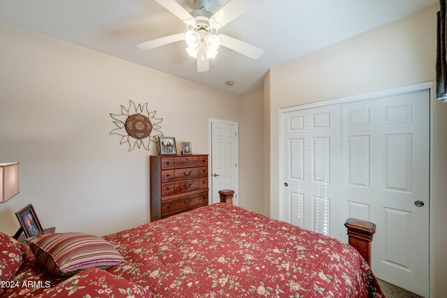 bedroom featuring ceiling fan and a closet