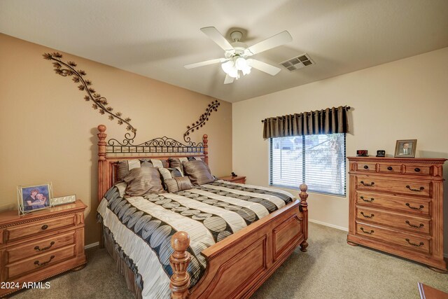 bedroom featuring light colored carpet and ceiling fan