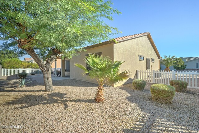 back of house with a patio