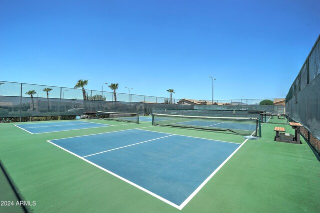 view of sport court with basketball hoop