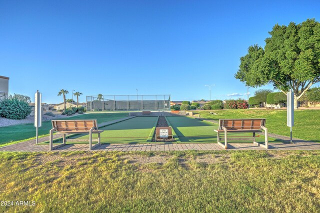 view of home's community featuring a lawn