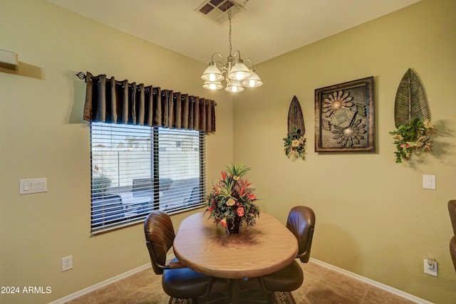 dining area with a notable chandelier