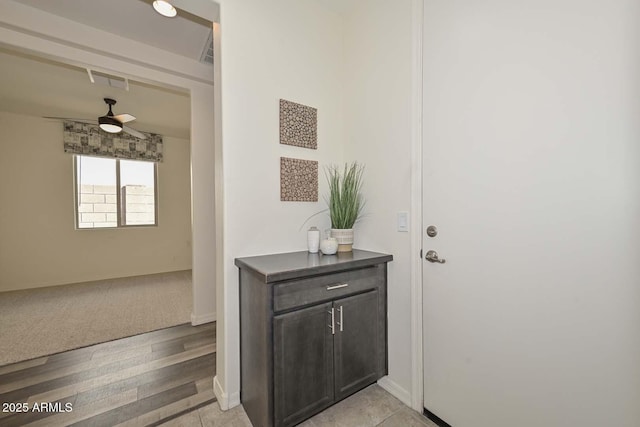 interior space with light wood-style flooring and baseboards