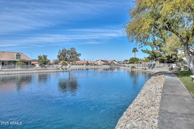 water view featuring fence