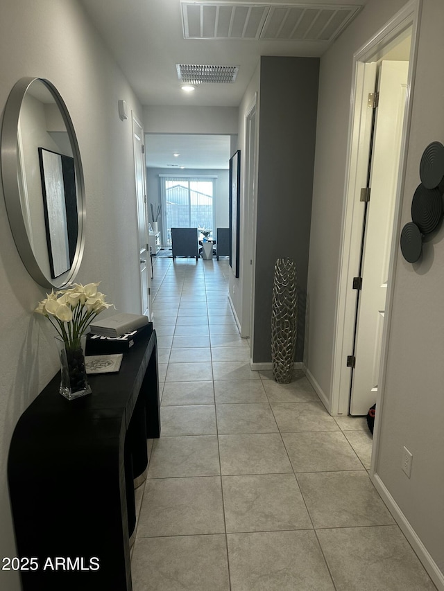 corridor with light tile patterned floors