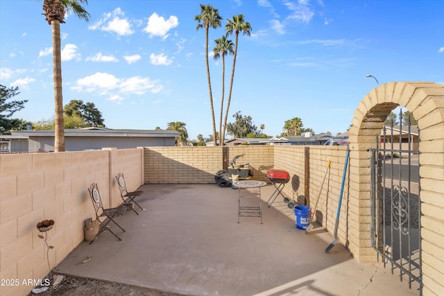 view of patio / terrace with a gate and fence