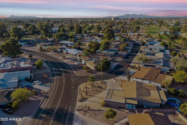 aerial view at dusk with a residential view and a mountain view