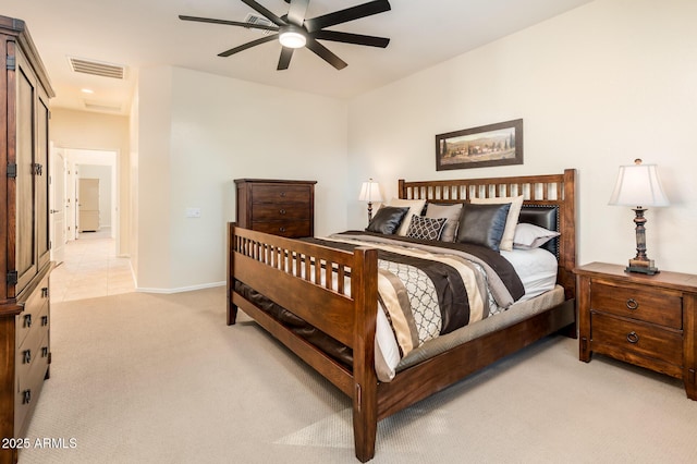 bedroom with ceiling fan and light carpet