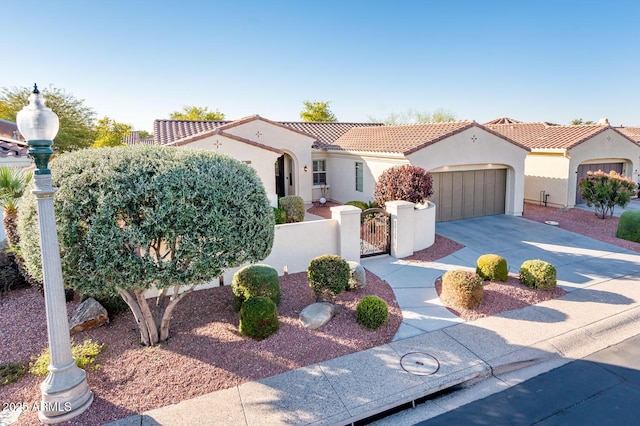 mediterranean / spanish home with a garage