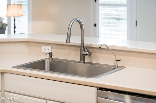 kitchen featuring dishwasher and sink