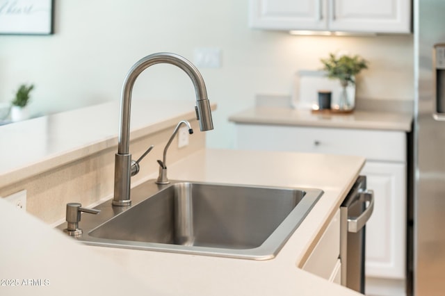 details featuring sink and white cabinets