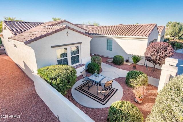 rear view of house featuring a patio