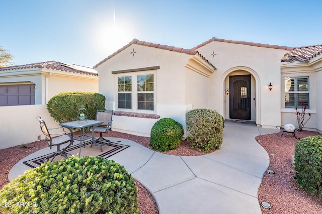 mediterranean / spanish-style home featuring a patio area