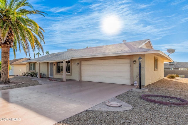 single story home featuring a garage