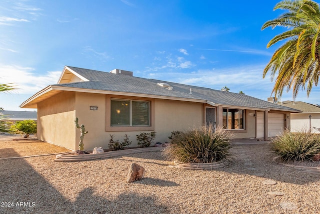 single story home with a garage