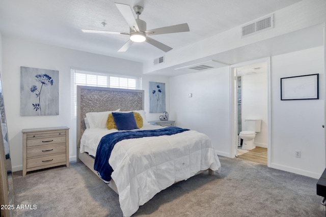 1211 N Miller Rd Unit 257, Scottsdale, AZ 85257 - bedroom with light carpet, ceiling fan, and ensuite bathroom