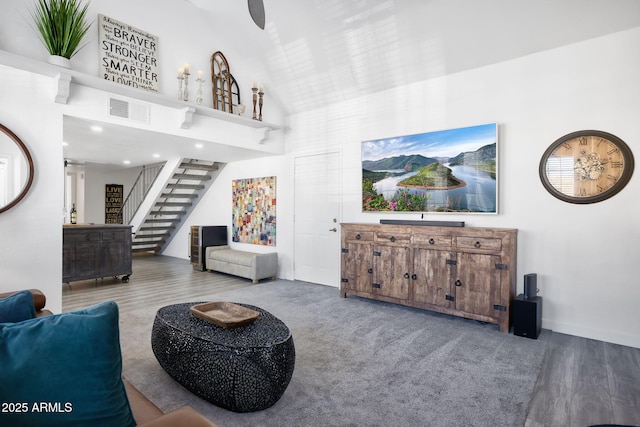 1211 N Miller Rd Unit 257, Scottsdale, AZ 85257 - living area featuring high vaulted ceiling, stairway, and wood finished floors