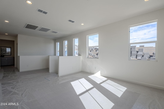 spare room featuring plenty of natural light