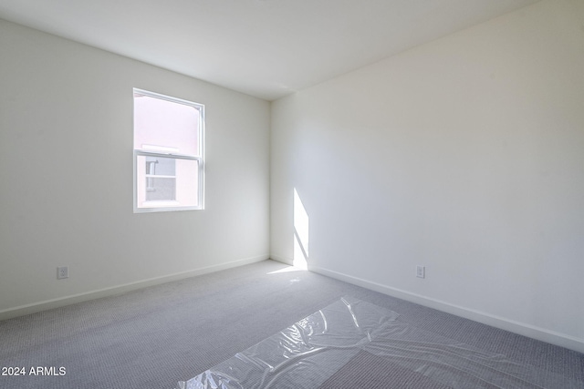 empty room with carpet flooring