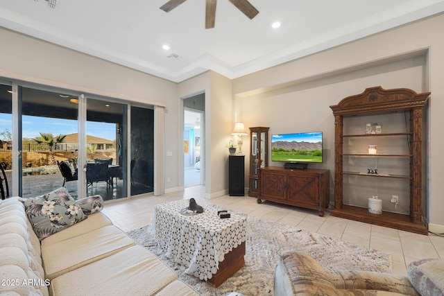 living room featuring light tile patterned floors and ceiling fan