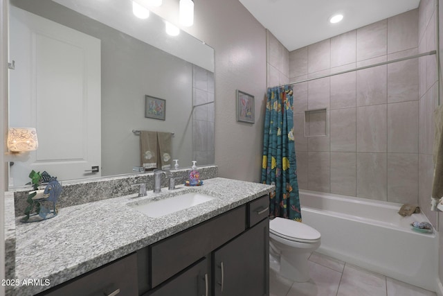 full bathroom featuring tile patterned floors, vanity, toilet, and shower / bath combo