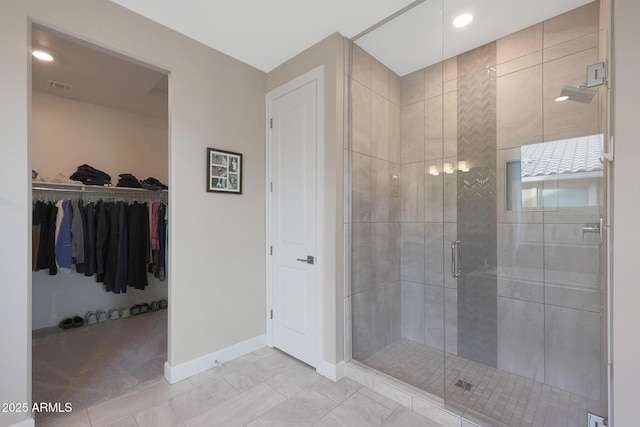 bathroom with a shower with shower door