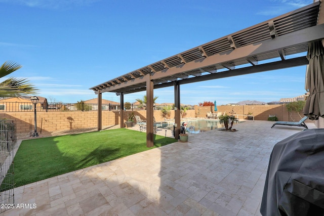 view of patio / terrace with area for grilling and a pergola