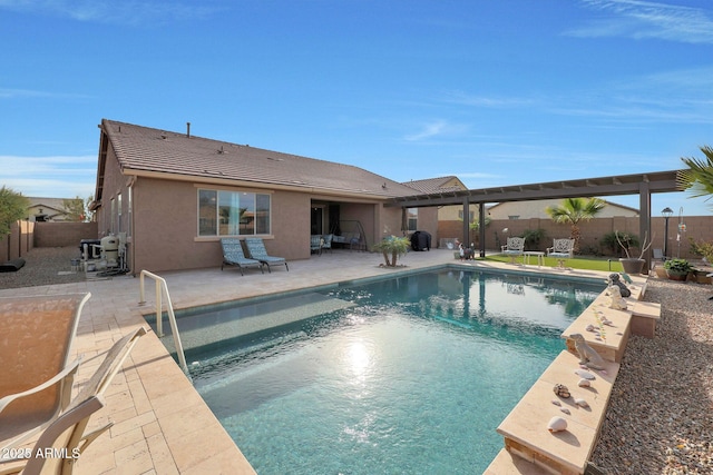 view of swimming pool featuring a patio area