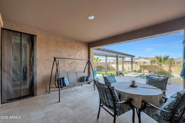 view of patio / terrace with a fenced in pool and a pergola