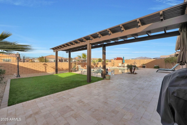 view of patio featuring grilling area and a pergola