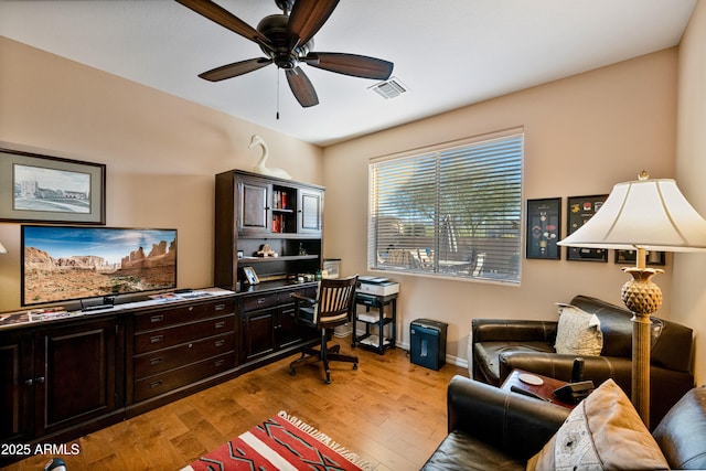 office space featuring light hardwood / wood-style floors and ceiling fan