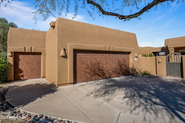 southwest-style home featuring a garage