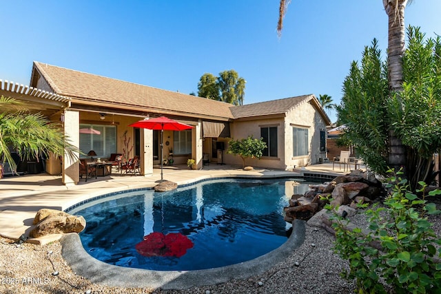 view of pool with a pergola and a patio area