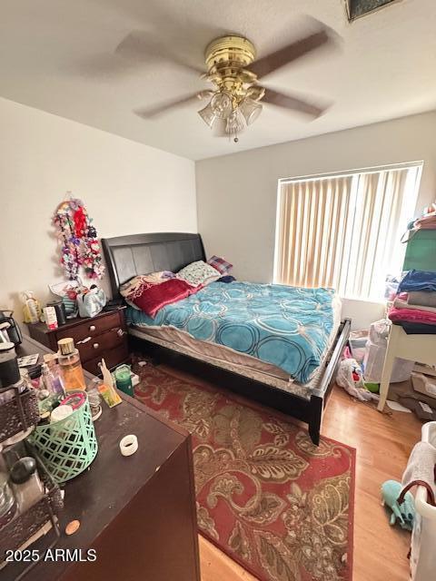 bedroom featuring ceiling fan and light wood-type flooring