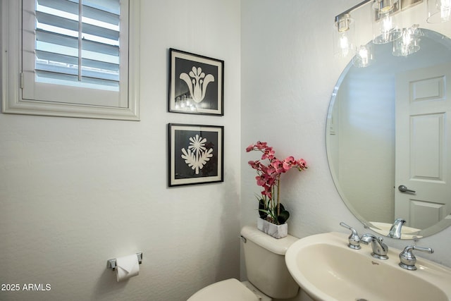 bathroom featuring toilet and sink