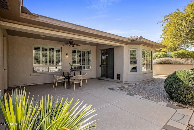 view of patio featuring ceiling fan