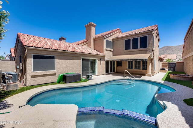11217 E Laurel Ln, Scottsdale, AZ 85259 - view of swimming pool featuring a pool with connected hot tub, a fenced backyard, and a patio area