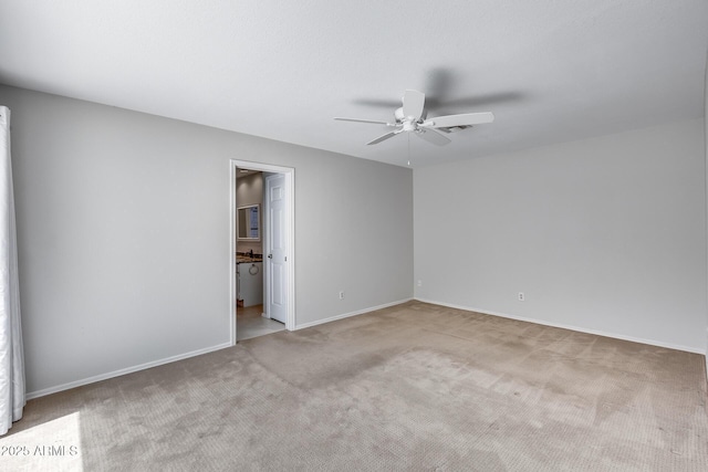 11217 E Laurel Ln, Scottsdale, AZ 85259 - unfurnished bedroom featuring carpet, a ceiling fan, and connected bathroom