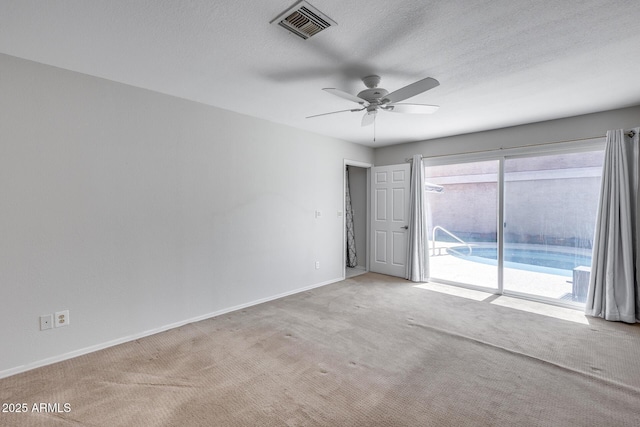 11217 E Laurel Ln, Scottsdale, AZ 85259 - unfurnished room with ceiling fan, carpet, and a textured ceiling