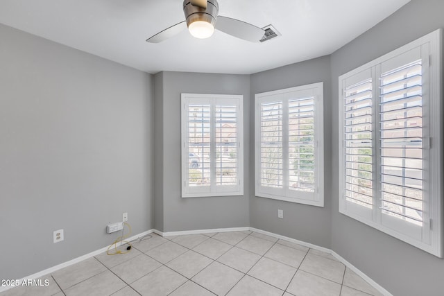 11217 E Laurel Ln, Scottsdale, AZ 85259 - spare room with ceiling fan and light tile patterned floors