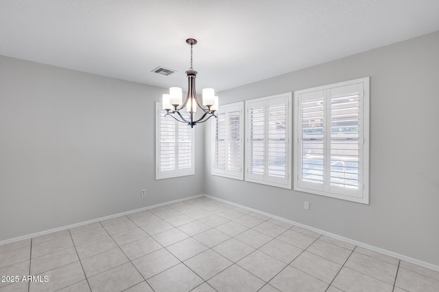 11217 E Laurel Ln, Scottsdale, AZ 85259 - spare room with a chandelier, plenty of natural light, and light tile patterned flooring