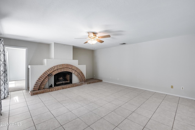 11217 E Laurel Ln, Scottsdale, AZ 85259 - unfurnished living room with ceiling fan, light tile patterned floors, and a fireplace