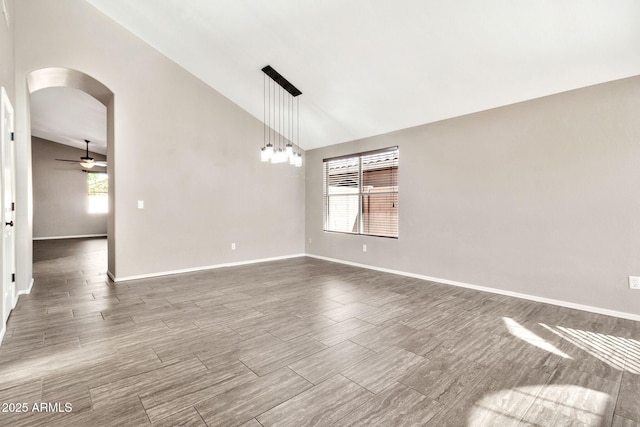 spare room with high vaulted ceiling and ceiling fan