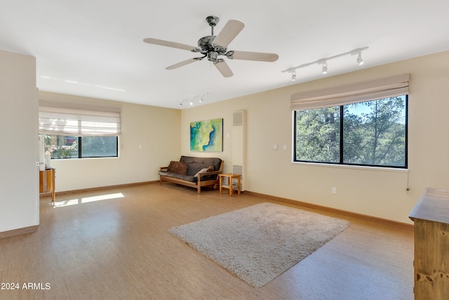 sitting room featuring ceiling fan and rail lighting