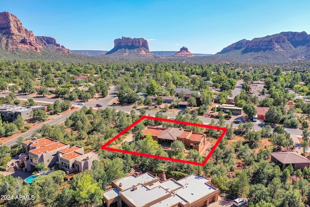 birds eye view of property featuring a mountain view