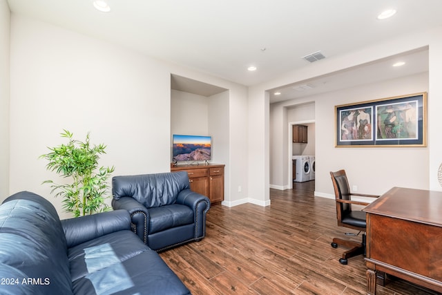 office with independent washer and dryer and dark wood-type flooring