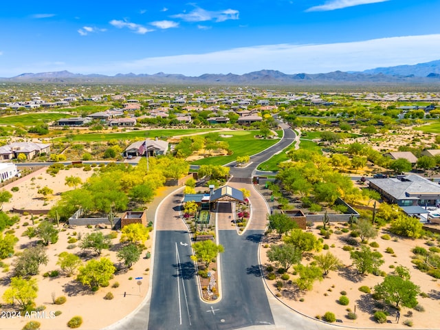 birds eye view of property with a mountain view