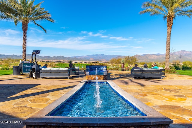 view of swimming pool featuring a mountain view and pool water feature